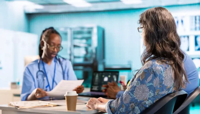 A doctor talking to a patient